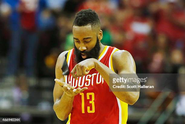 James Harden of the Houston Rockets celebrates after a three-point shot on the court during their game against the Denver Nuggets at the Toyota...