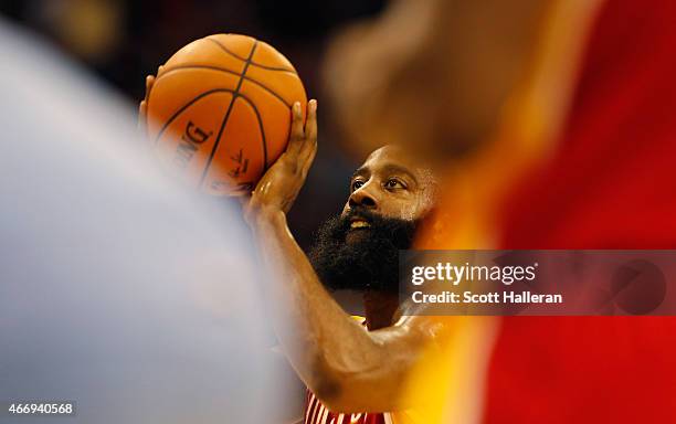 James Harden of the Houston Rockets takes a free throw on the court during their game against the Denver Nuggets at the Toyota Center on March 19,...