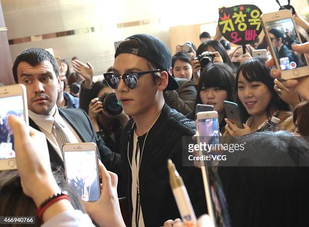 Fans take photos with their smart phones as South Korean actor Ji Chang-Wook arrives at hotel on March 19, 2015 in Shanghai, China.