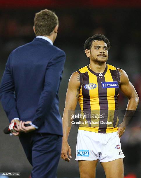 Cyril Rioli of the Hawks is approach by Cameron Mooney of Fox Footy for an interview after their win during the NAB Challenge AFL match between St...