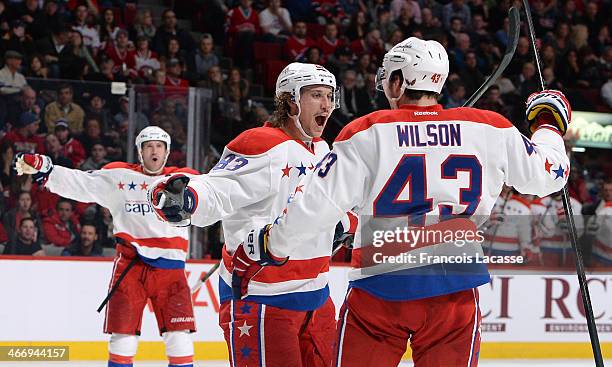 Jay Beagle of the Washington Capitals, celebrates with teammate Tom Wilson, after scoring a goal against the Montreal Canadiens during the NHL game...