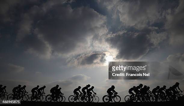 The peloton rides through Al Mafjar during stage two of the 2014 Ladies Tour of Qatar from Al Zubara to Madinat Al Shamal on February 5, 2014 in...