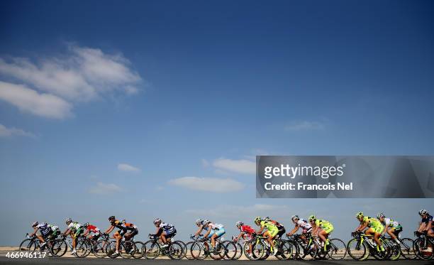 The peloton rides through Al Mazzara during stage two of the 2014 Ladies Tour of Qatar from Al Zubara to Madinat Al Shamal on February 5, 2014 in...