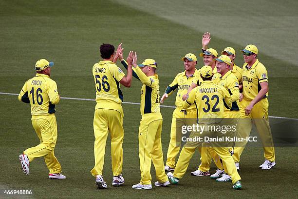 Shane Watson of Australia celebrates with his team mates after taking a catch tp dismiss Sarfaraz Ahmed of Pakistan during the 2015 ICC Cricket World...