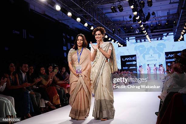 Anavila Misra and Dia Mirza walk the runway during the Anavila show on day 2 as part of Lakme Fashion Week Summer/Resort 2015 at Palladium Hotel on...