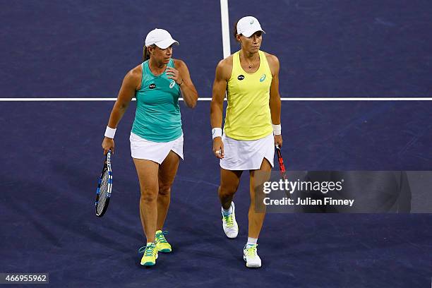 Lisa Raymond of USA and Sam Stosur of Australia look on against Martina Hingis of Switzerland and Sania Mirza of India in the doubles during day...