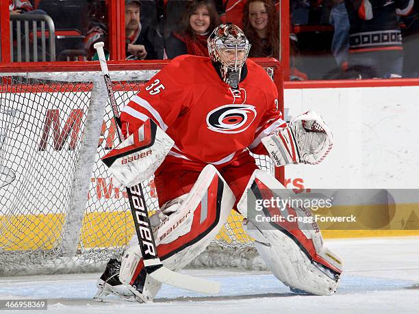 Justin Peters of the Carolina Hurricanes stands tall in the crease to defend the net during warm ups prior to an NHL game against the Ottawa Senators...