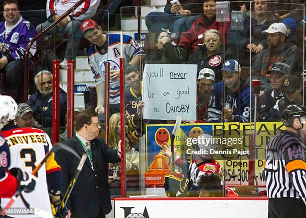 Forward Connor McDavid of the Erie Otters is heckled by fans while serving a penalty during a game against the Windsor Spitfires on March 19, 2015 at...