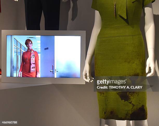 With AFP Story by Jennie MATTHEW: Entertainment-US-television-MadMen-museum,FOCUS Joan Holloway's dress from the show, part of Matthew Weiner's "Mad...