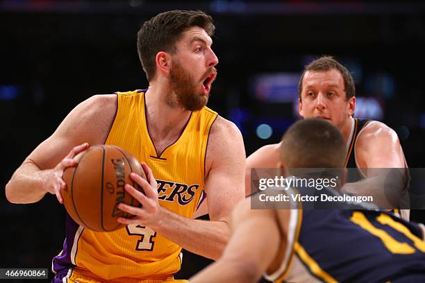 Ryan Kelly of the Los Angeles Lakers looks to make a pass play against Joe Ingles and Dante Exum of the Utah Jazz in the second half during the NBA...