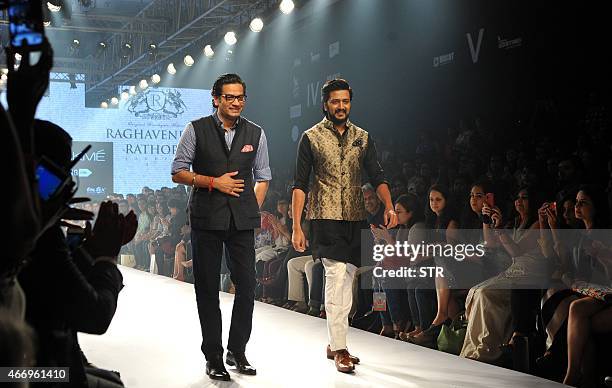 Indian Bollywood actor Ritesh Deshmukh showcases a creation by designer Raghavendra Rathore on the second day of the Lakme Fashion Week summer/resort...