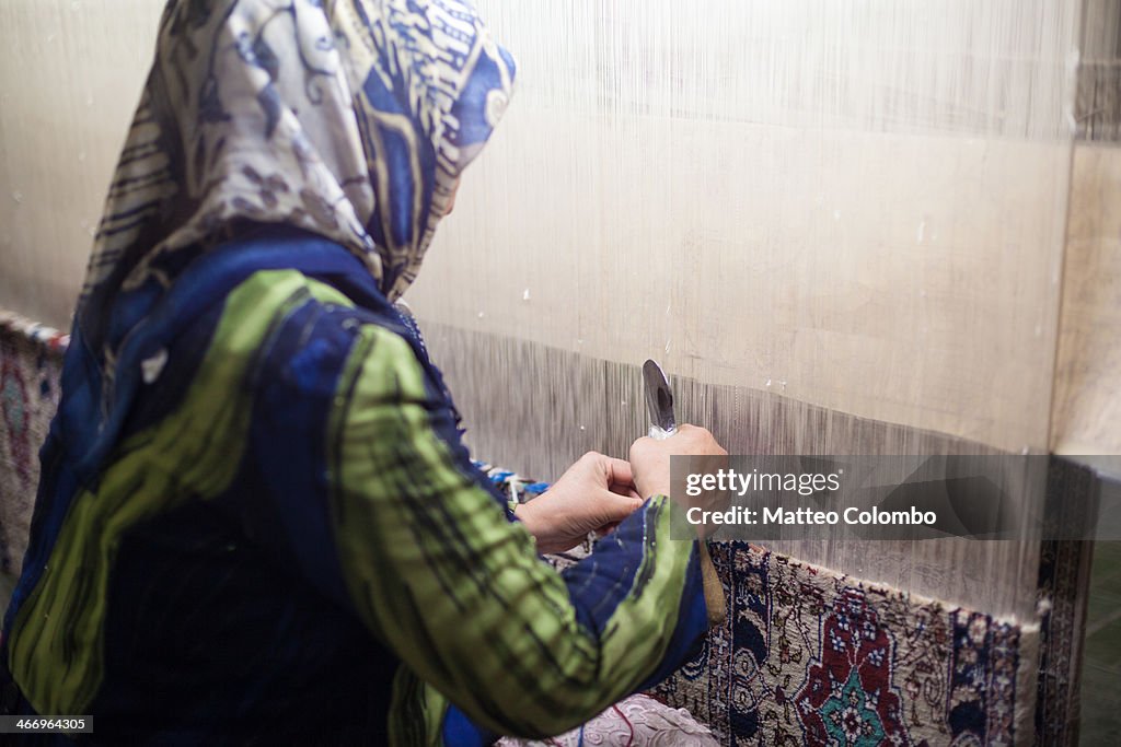 Woman weaving silk in Kashgar, Xinjiang, China