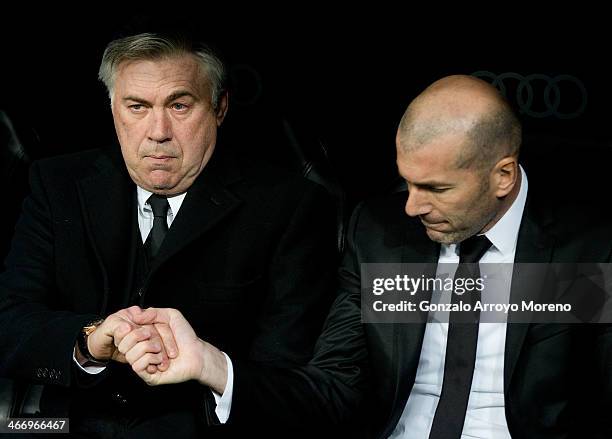 Head coach Carlo Ancelotti of Real Madrid CF shake hands with his assistant coach Zinedine Zidane during the Copa del Rey semifinal first leg match...