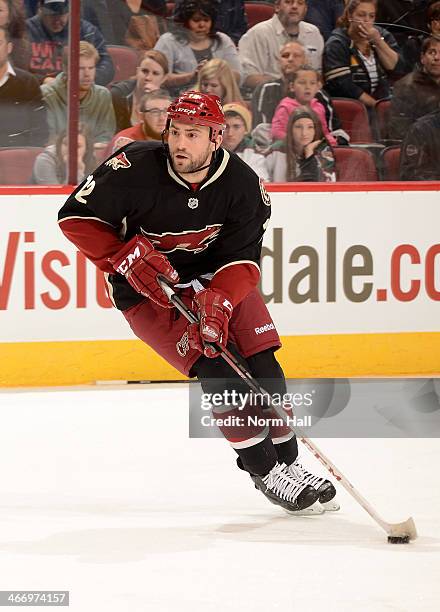 Paul Bissonnette of the Phoenix Coyotes skates the puck up ice against the Los Angeles Kings at Jobing.com Arena on January 28, 2014 in Glendale,...