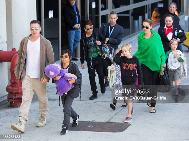 Brad Pitt and Angelina Jolie are seen after landing at Los Angeles International Airport with their children, Pax Jolie-Pitt, Maddox Jolie-Pitt,...