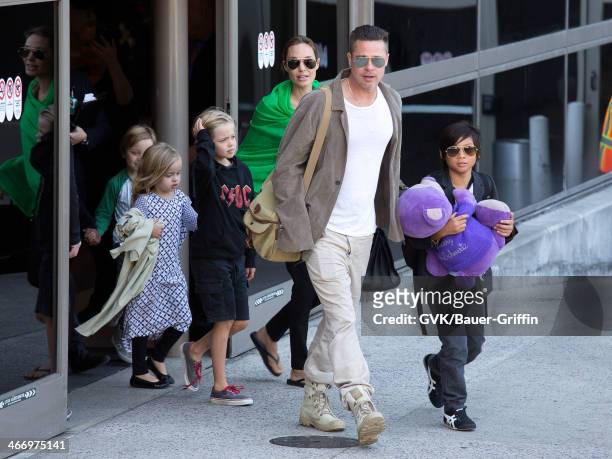 Brad Pitt and Angelina Jolie are seen after landing at Los Angeles International Airport with their children, Pax Jolie-Pitt, Shiloh Jolie-Pitt,...