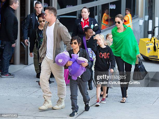 Brad Pitt and Angelina Jolie are seen after landing at Los Angeles International Airport with their children, Pax Jolie-Pitt, Maddox Jolie-Pitt,...