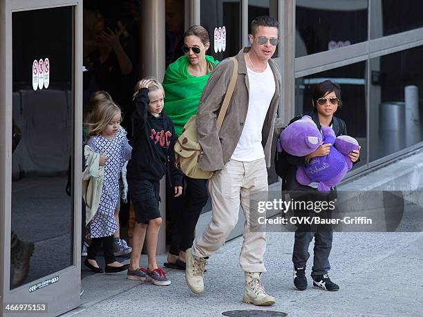 Brad Pitt and Angelina Jolie are seen after landing at Los Angeles International Airport with their children, Pax Jolie-Pitt, Shiloh Jolie-Pitt,...