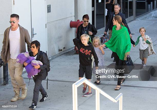 Brad Pitt and Angelina Jolie are seen after landing at Los Angeles International Airport with their children, Pax Jolie-Pitt, Maddox Jolie-Pitt,...