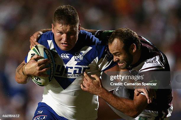 Greg Eastwood of the Bulldogs is tackled by Brett Stewart of the Sea Eagles during the round 3 NRL match between the Manly Warringhah Sea Eagles and...