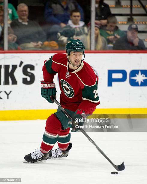 Keith Ballard of the Minnesota Wild controls the puck during the game against the Chicago Blackhawks on January 23, 2014 at Xcel Energy Center in St...