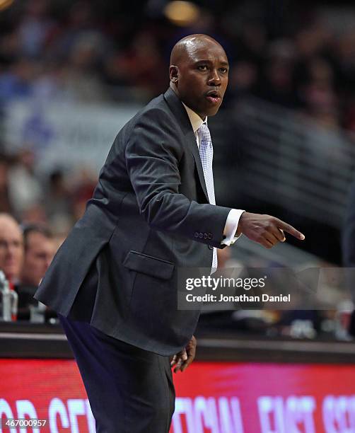 Head coach Jacque Vaughn of the Orlando Magic gives instructions to his team during a game against the Chicago Bulls at the United Center on December...