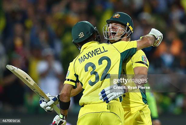 Shane Watson and Glenn Maxwell of Australia celebrate victory during the 2015 ICC Cricket World Cup match between Australian and Pakistan at Adelaide...