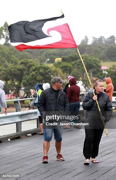 Tino Rangatiratanga flag proves difficult to hold on to in windy conditions on the Waitangi River Bridge on Waitangi Day, February 6, 2014 in Paihia,...