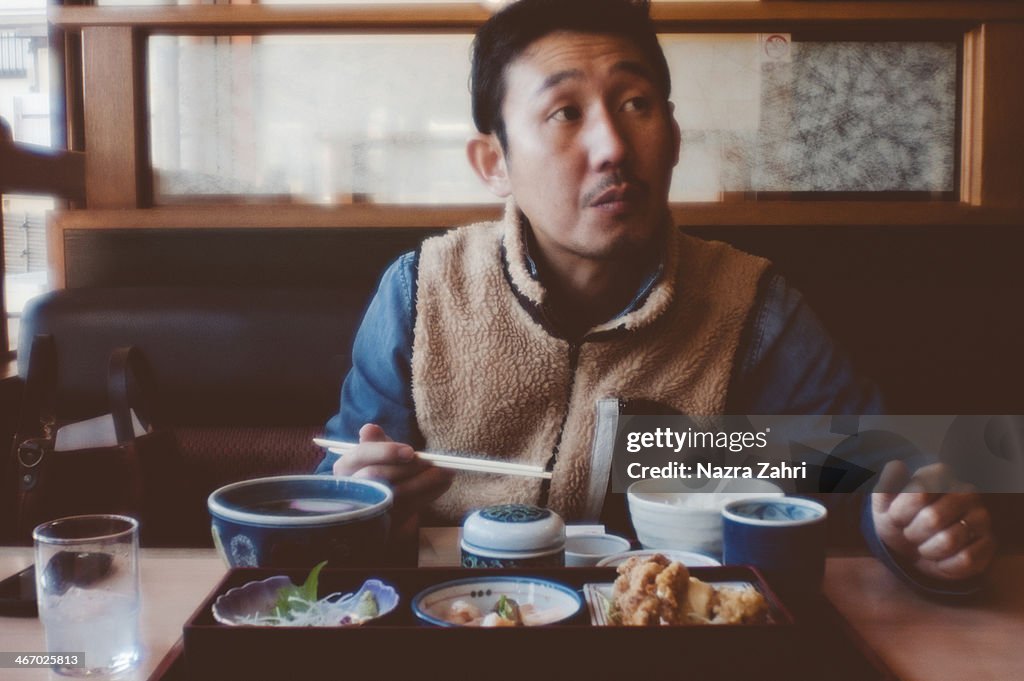 Japanese man having Japanese lunch at a restaurant