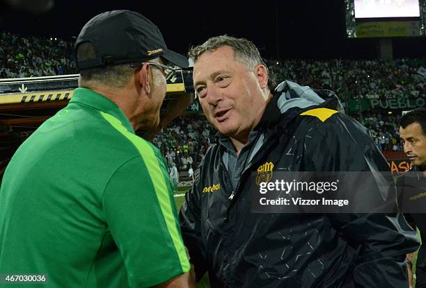 Juan Carlos Osorio coach of Barcelona de Ecuador greets Ruben Israel coach of Atletico Nacional prior a match as part of Copa Libertadores 2015 at...