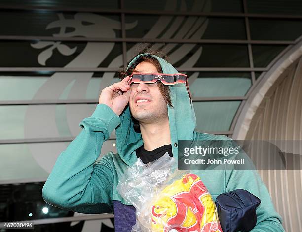 Lazar Markovic of Liverpool checks out the eclipse before a training session at Melwood Training Ground on March 20, 2015 in Liverpool, England.