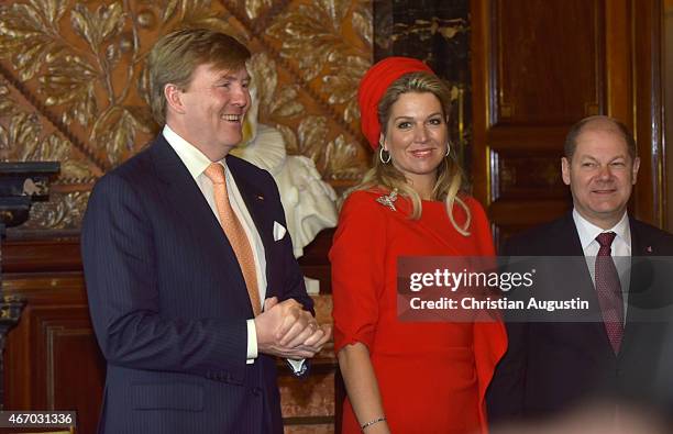 Queen Maxima and King Willem-Alexander of The Netherlands attend by mayor Olaf Scholz sign the golden book of the city of Hamburg at the townhall of...