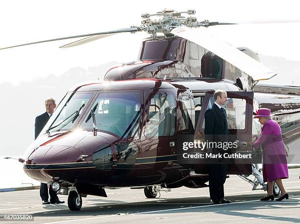 Queen Elizabeth II departs from the flight deck of HMS Ocean after an official visit on March 20, 2015 in Plymouth, England.