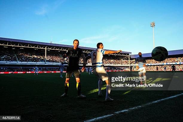 Harry Kane of Tottenham Hotspur and Rio Ferdinand of QPR look on as the ball goes out of play during the Barclays Premier League match between Queens...