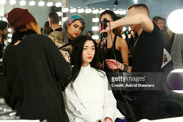 Models prepare backstage at Wildfox during Mercedes-Benz Fashion Week Fall 2014 at Pier 59 on February 5, 2014 in New York City.
