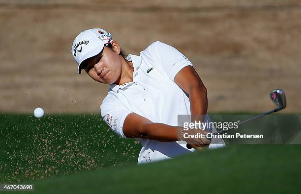 Yani Tseng of Chinese Taipei chips from the bunker onto the 11th green during the continuation of the first round of the LPGA Founders Cup at...