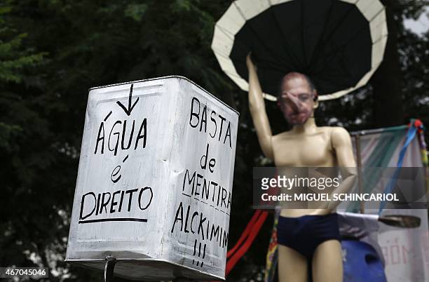 Puppet representing the Governor of Sao Paulo state, Geraldo Alckmin, is seen during a protest against the hydro crisis in the state at Paulista...