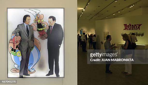 Portraits of creators of French comic "Asterix le Gaulois", Albert Uderzo and Rene Goscinny are seen at the entrance of the exhibition "Asterix en...