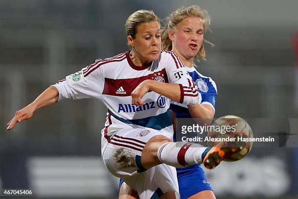 Vanessa Buerki of Muenchen battles for the ball with Tabea Kemme of Potsdam during the Allianz Frauen-Bundesliga match between FC Bayern Muenchen and...