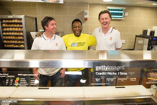 Robbie Fower, Pele and Steve McManaman attend Subway Restaurant in New Oxford Street on March 20, 2015 in London, England.