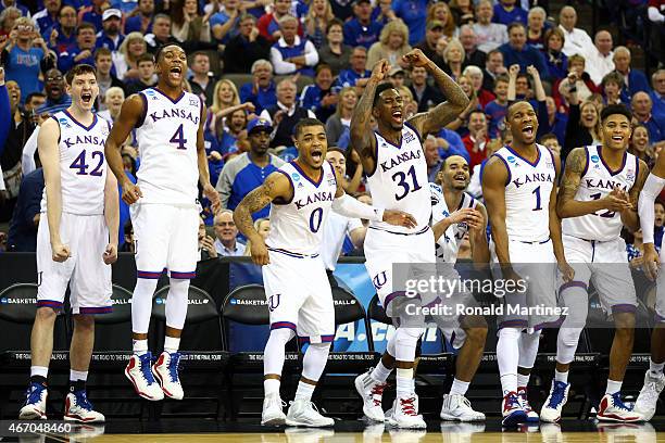 The Kansas Jayhawks bench reacts in the closing minutes against the New Mexico State Aggies during the second round of the 2015 NCAA Men's Basketball...