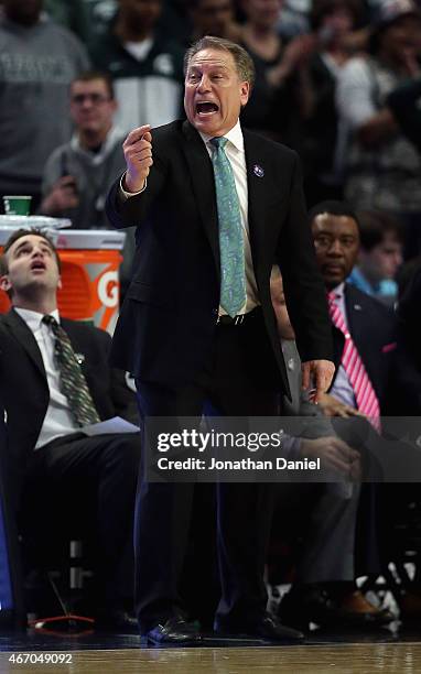 Head coach Tom Izzo of the Michigan State Spartans gives instructions to his team against the Wisconsin Badgers during the Championship game of the...