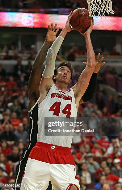Frank Kaminsky of the Wisconsin Badgers goes up for Michigan State Spartans shot against the Michigan State Spartans during the Championship game of...
