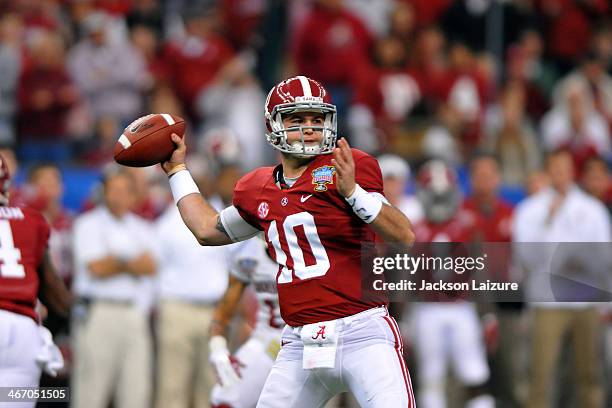 Quarterback AJ McCarron of the Alabama Crimson Tide drops back to pass during their loss to the Oklahoma Sooners in the BCS Sugar Bowl on January 2,...