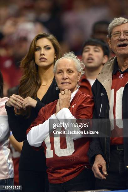 Katherine Webb girlfriend of quarterback AJ McCarron of the Alabama Crimson Tide reacts to second half action with McCarron's family during their...