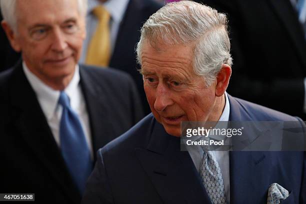 Prince Charles, Prince of Wales, interacts with exhibitors alongside Kentucky Governor Steve Beshear while touring a cultural festival at the...