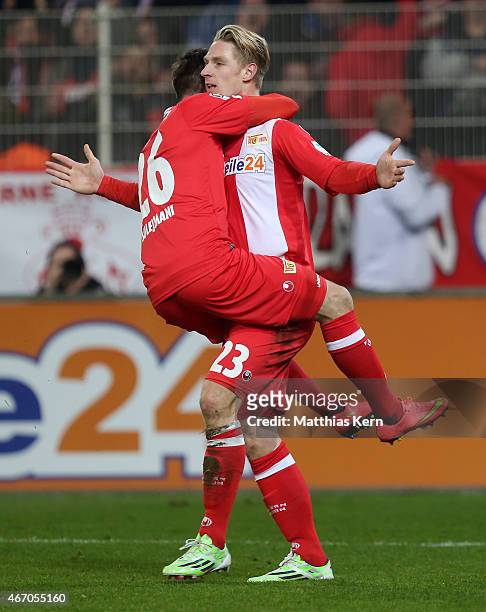 Sebastian Polter of Berlin jubilates with team mate Valmir Sulejmani after scoring the first goal during the Second Bundesliga match between 1.FC...