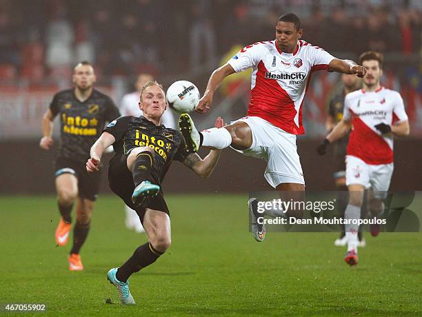 Sebastian Haller of Utrecht and Henrico Drost of NAC battle for the ball during the Dutch Eredivisie match between FC Utrecht and NAC Breda held at...