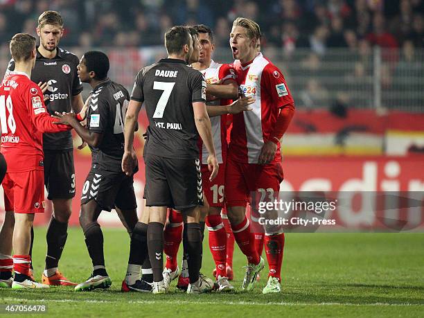 Dennis Daube of FC St.Pauli and Sebastian Polter of 1 FC Union Berlin argue during the match between Union Berlin and FC St. Pauli on March 20, 2015...