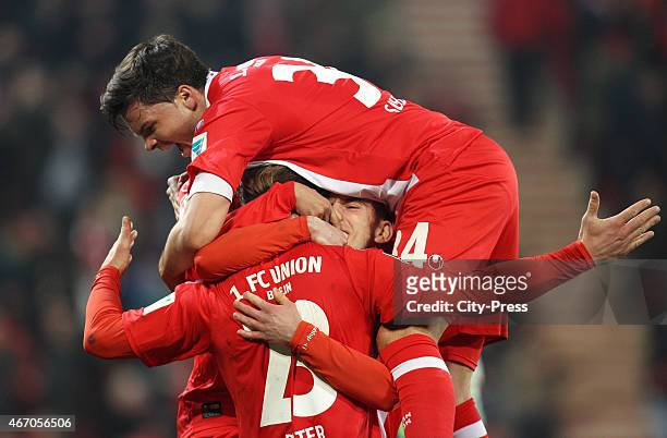 Sebastian Polter, Valmir Sulejmani and Fabian Schoenheim of 1 FC Union Berlin celebrate after scoring the 1:0 during the match between Union Berlin...
